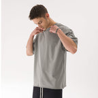 דוגמן לובש JINX FADED RAW – חולצת JINX IT אפורה 260GSM